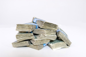 stacks of cash Charlotte Injury Lawyer Mecklenburg Car Accident Attorney