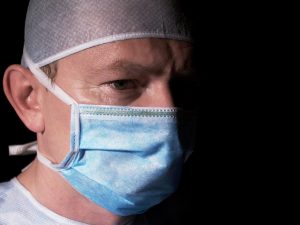 surgeon-with-mask-Charlotte-Monroe-Lake-Norman-Law-Firm-300x225